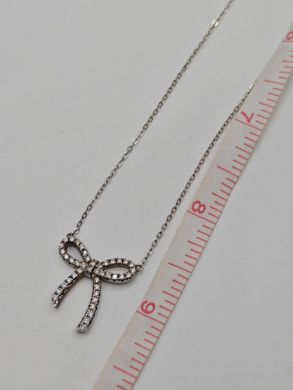 Sterling Silver Moissanite Bow Shape Necklace - Picture 4 of 6